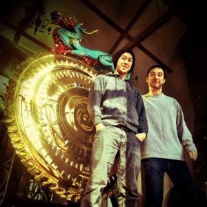 Doug and Eve standing in front of the dragon clock
